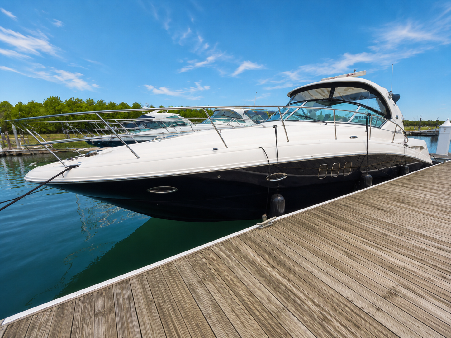 The Edge of Glory yacht docked at the marina on a clear day